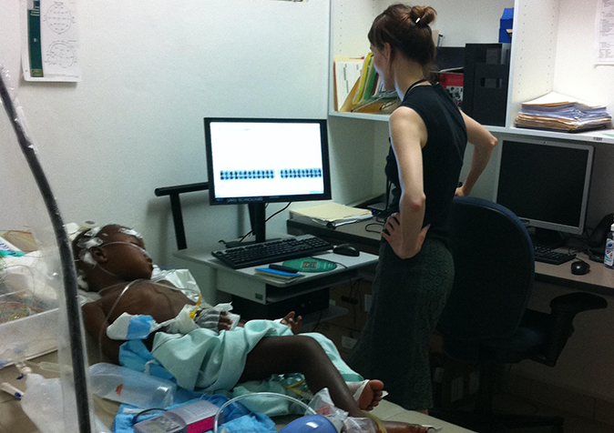 Joanna Hellmuth, MD with a patient in Haiti