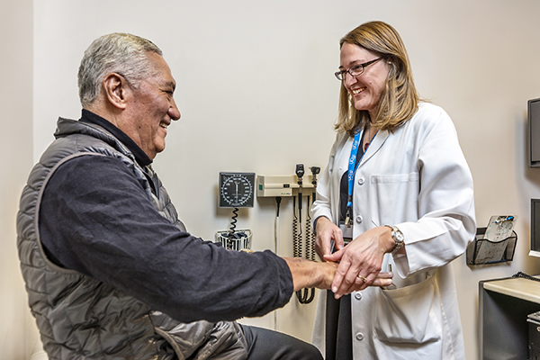 Dr. Cathy Lomen-Hoerth with a patient
